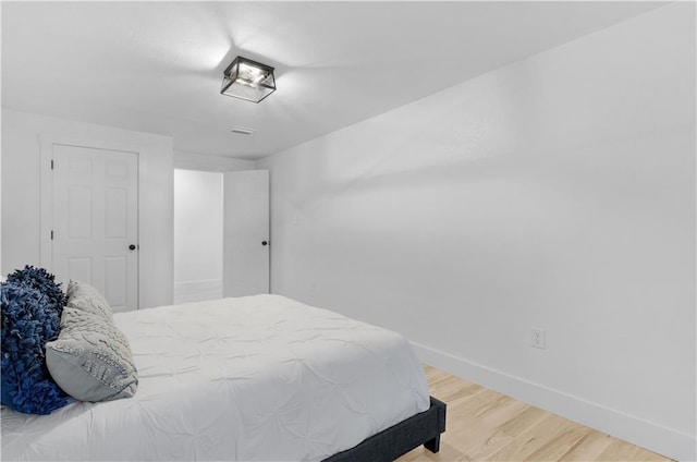 bedroom featuring wood-type flooring