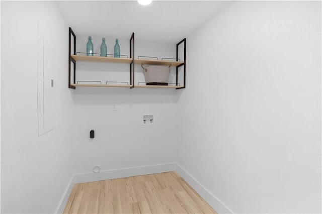 laundry room with washer hookup and hardwood / wood-style floors