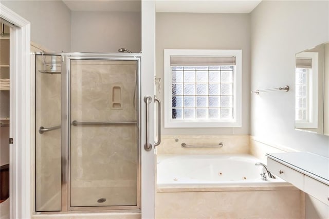 full bath featuring a tub with jets and a stall shower