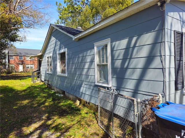 view of property exterior featuring a yard