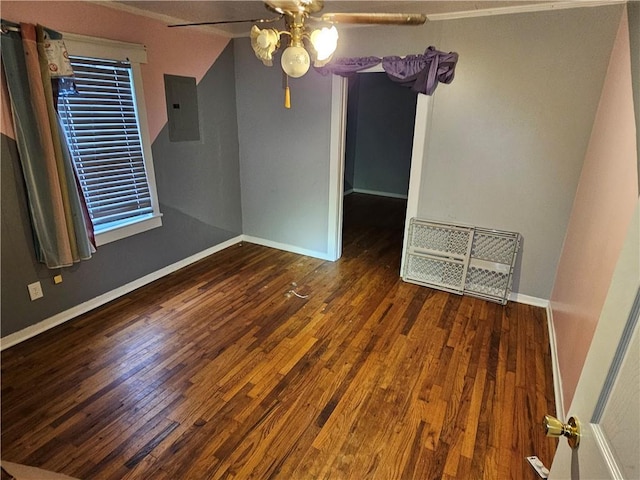 spare room with baseboards, electric panel, visible vents, and hardwood / wood-style floors