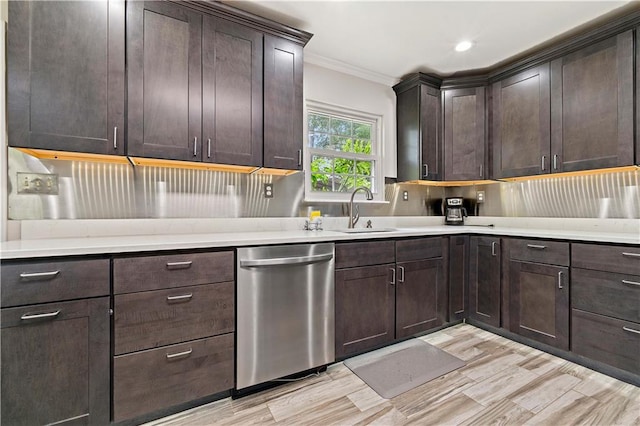 kitchen with dark brown cabinets, crown molding, sink, and stainless steel dishwasher