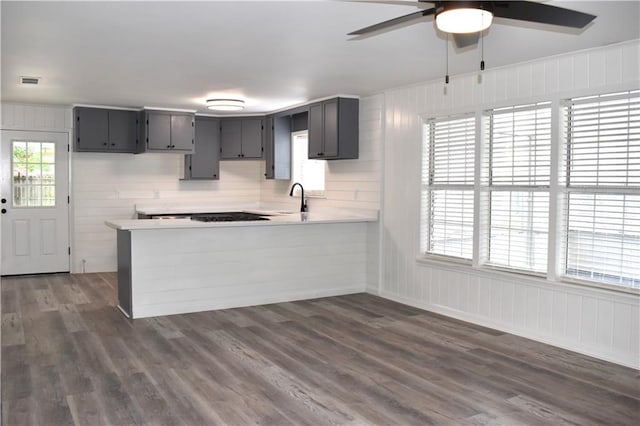 6208 Anthony Dr W, Theodore, AL 36582 - kitchen featuring light countertops, a ceiling fan, a peninsula, and dark wood-type flooring