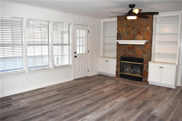 6208 Anthony Dr W, Theodore, AL 36582 - unfurnished living room featuring dark wood finished floors, a wealth of natural light, and a fireplace