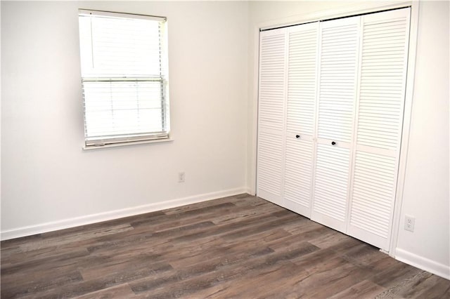 6208 Anthony Dr W, Theodore, AL 36582 - unfurnished bedroom with a closet, dark wood finished floors, and baseboards