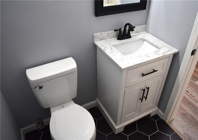 6208 Anthony Dr W, Theodore, AL 36582 - half bath with vanity, baseboards, and toilet
