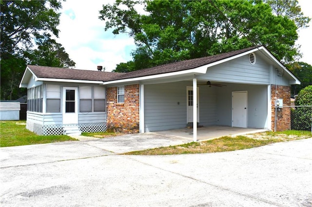 6208 Anthony Dr W, Theodore, AL 36582 - ranch-style house featuring brick siding, a ceiling fan, entry steps, driveway, and a carport