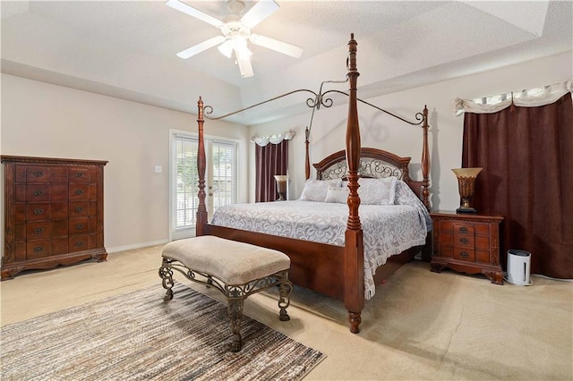 bedroom featuring light carpet, access to exterior, a textured ceiling, and ceiling fan