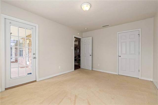 carpeted spare room with a healthy amount of sunlight