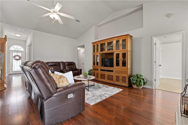 living room featuring dark wood-type flooring, ceiling fan, and high vaulted ceiling