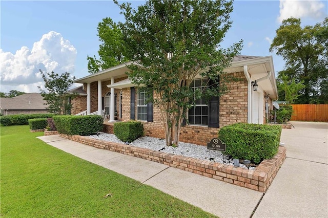 view of front of property with a garage and a front yard