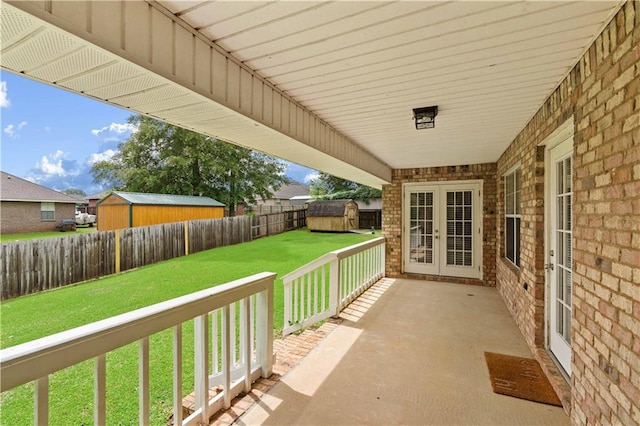 view of patio featuring a shed