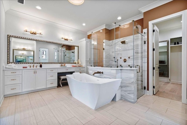 bathroom featuring independent shower and bath, oversized vanity, tile walls, and tile floors