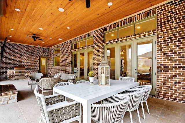 view of patio / terrace featuring french doors and ceiling fan