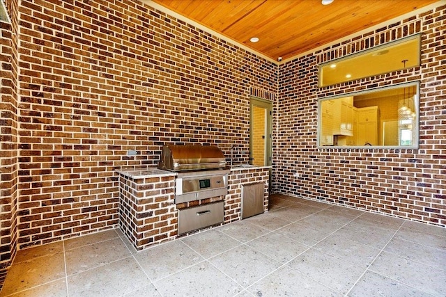 interior space with a grill and exterior kitchen