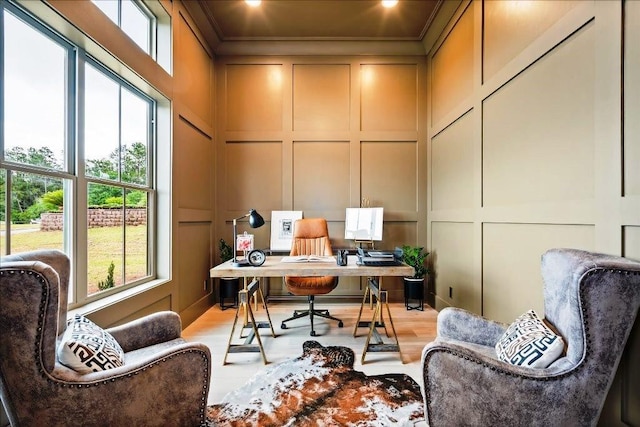 office area featuring crown molding and light wood-type flooring