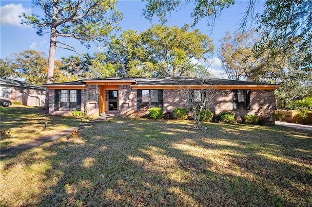 rear view of property featuring a yard