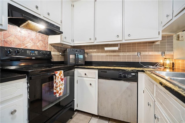 kitchen featuring dishwasher, black electric range oven, and white cabinetry