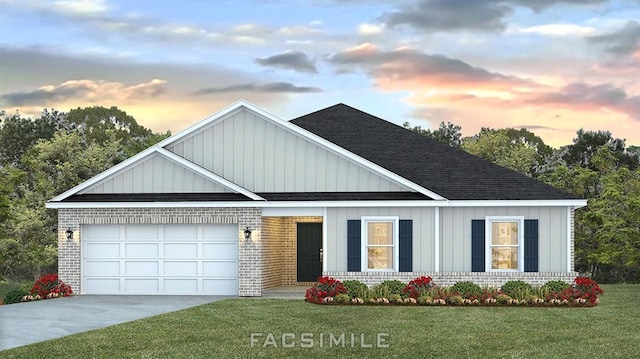 12540 Smith Rd, Grand Bay, AL 36541 - view of front facade featuring brick siding, a garage, a lawn, driveway, and board and batten siding