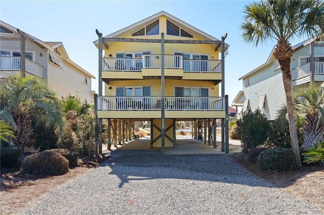 coastal home with a carport and a balcony