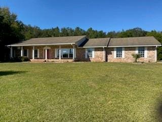 ranch-style home with a front lawn