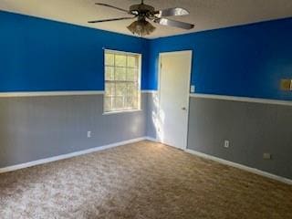 spare room with carpet flooring and ceiling fan