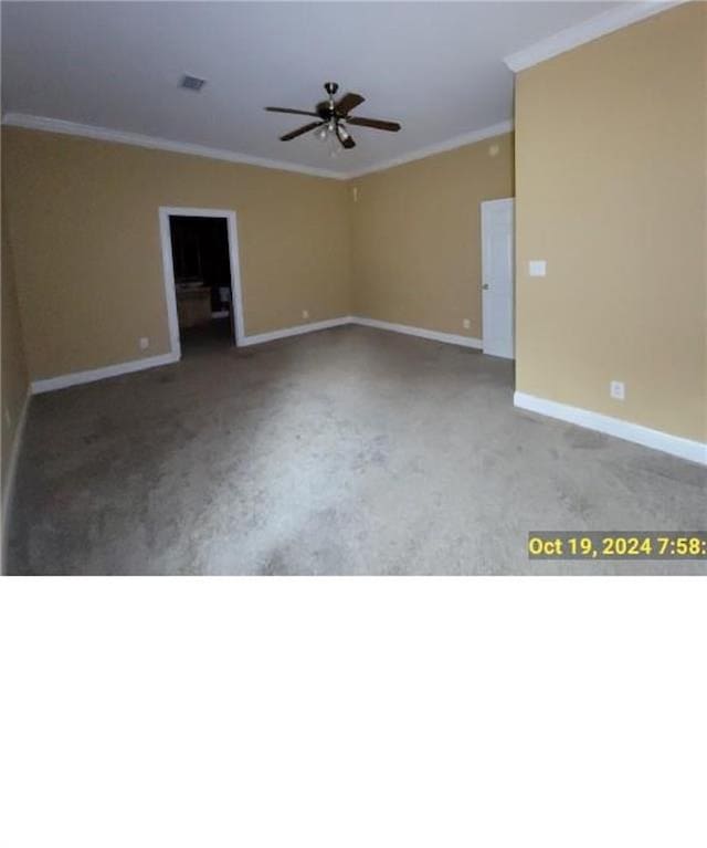 empty room with ornamental molding, light carpet, and ceiling fan