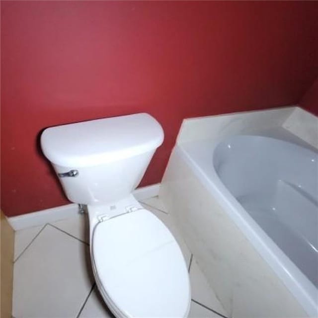 bathroom featuring tile patterned floors and toilet