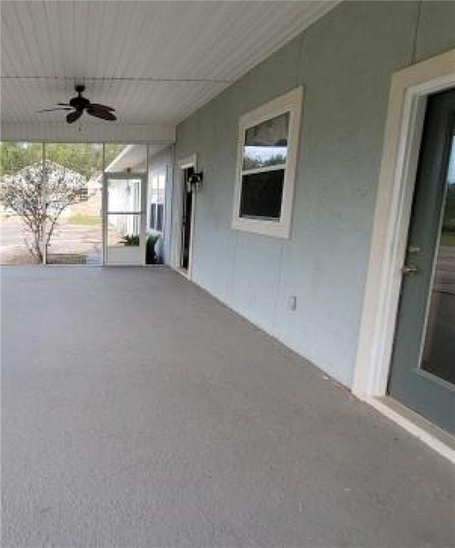 view of patio featuring ceiling fan