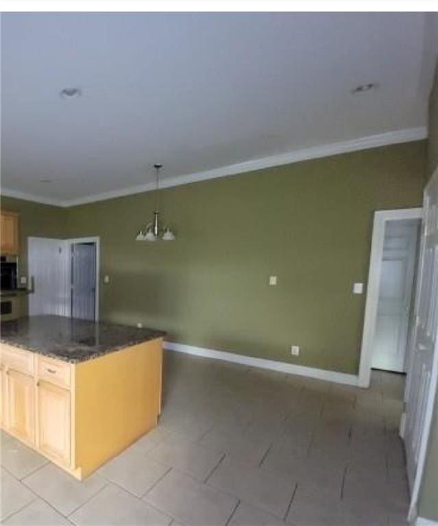 kitchen with ornamental molding, decorative light fixtures, light brown cabinetry, and a chandelier