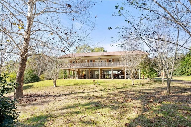 back of property with a lawn