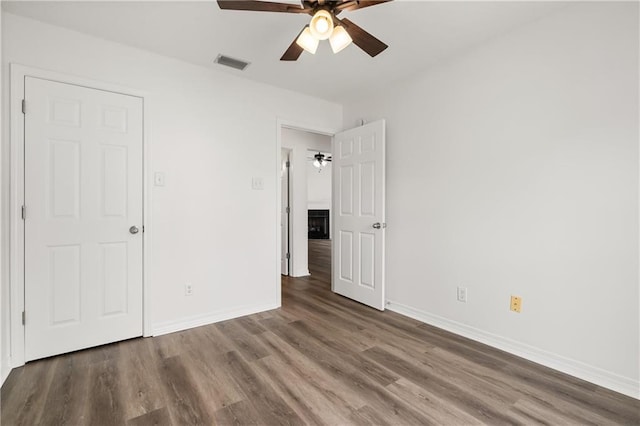 unfurnished bedroom with wood-type flooring and ceiling fan