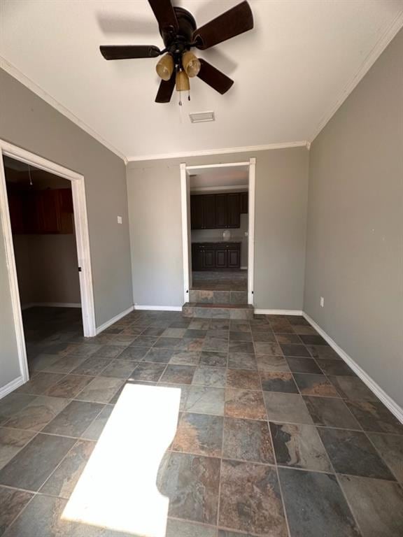 unfurnished living room with ceiling fan and ornamental molding