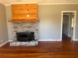 unfurnished living room featuring dark hardwood / wood-style flooring, a wood stove, and crown molding