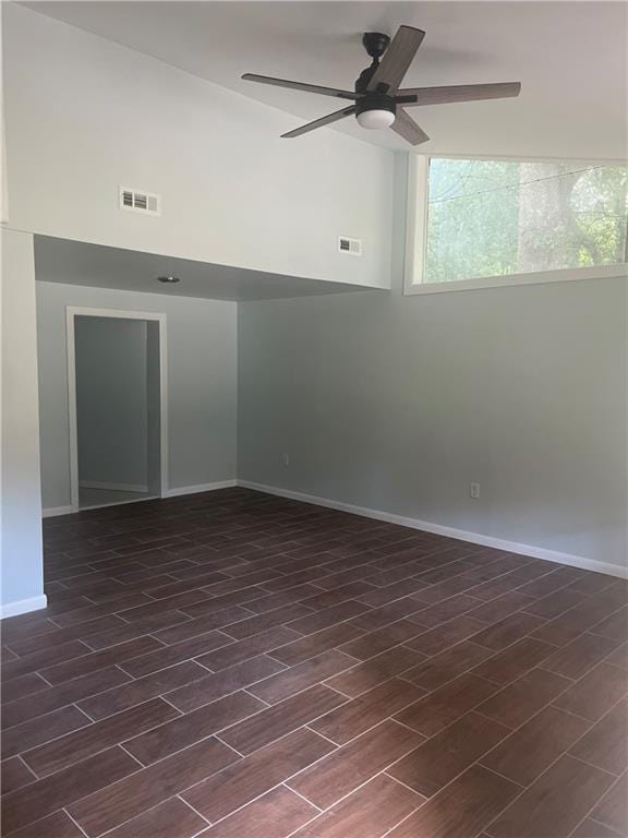 spare room featuring dark hardwood / wood-style floors and ceiling fan