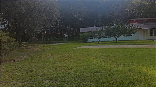 view of yard featuring a carport