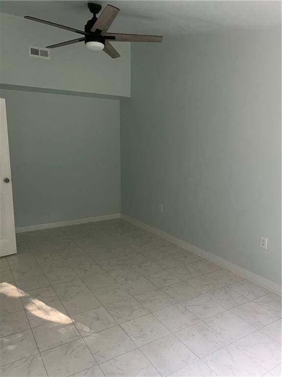 spare room with ceiling fan