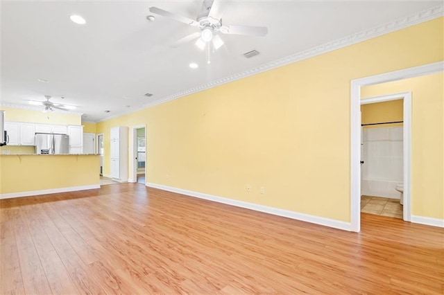 unfurnished living room with light hardwood / wood-style floors, ornamental molding, and ceiling fan