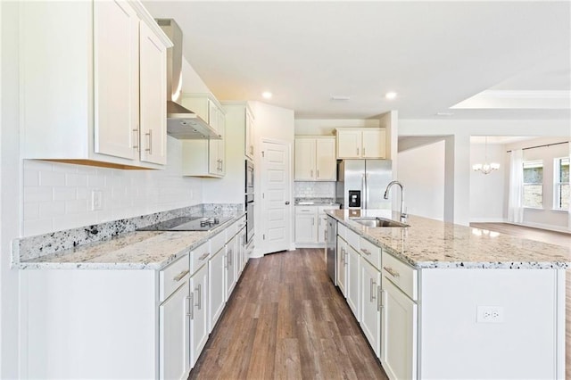 kitchen featuring decorative light fixtures, appliances with stainless steel finishes, sink, dark hardwood / wood-style floors, and decorative backsplash