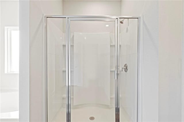 full bathroom featuring a stall shower