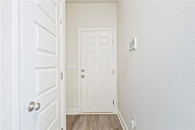 doorway to outside featuring light wood-type flooring