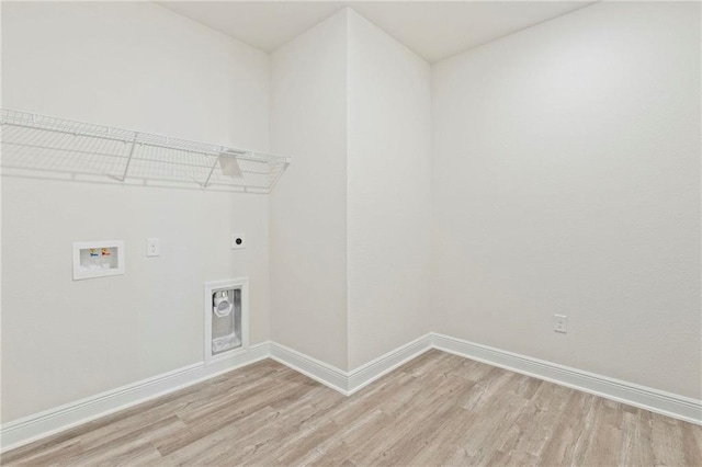 laundry room featuring light wood-type flooring, laundry area, baseboards, and electric dryer hookup