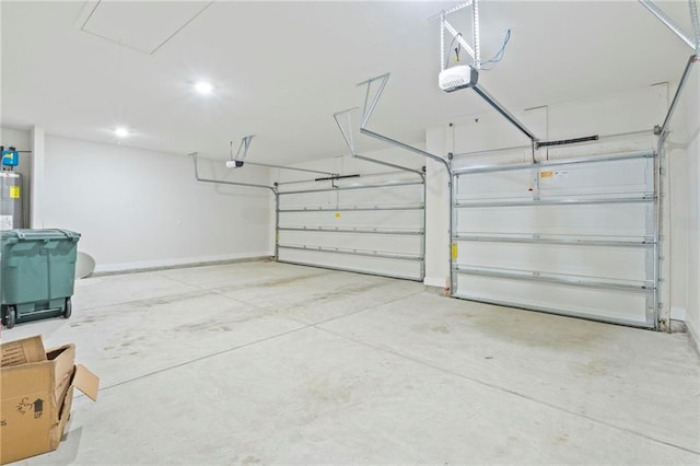 garage featuring a garage door opener and baseboards