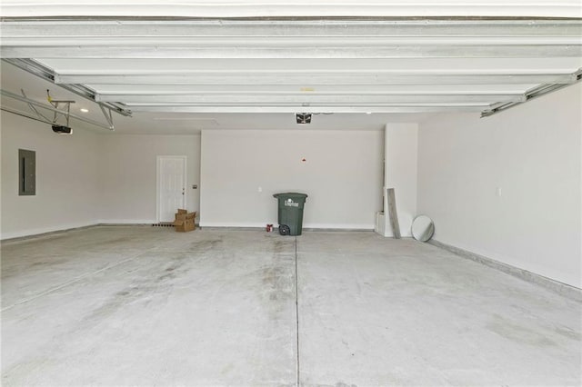 garage featuring baseboards, electric panel, and a garage door opener