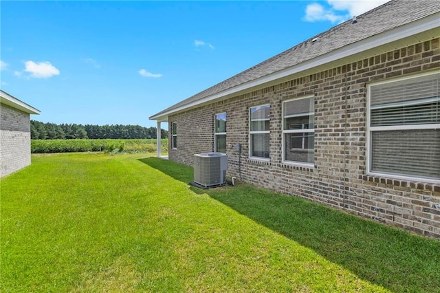 view of yard featuring central AC unit