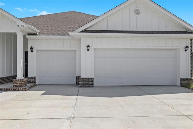 garage with concrete driveway