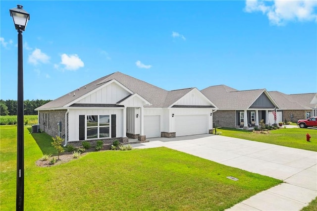 view of front of house featuring a front yard and a garage