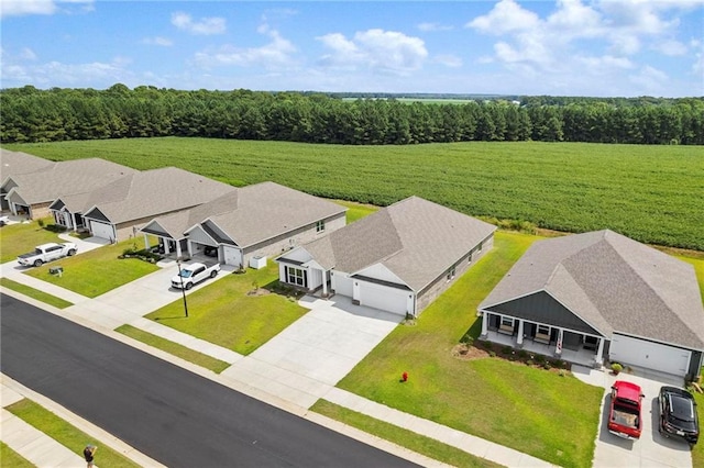 bird's eye view featuring a residential view and a forest view