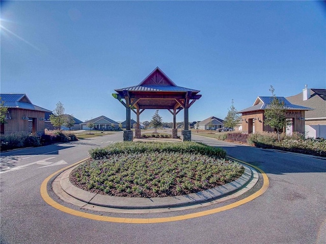 exterior space featuring a gazebo and a residential view