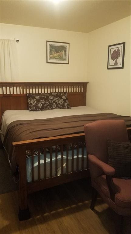 bedroom featuring wood-type flooring